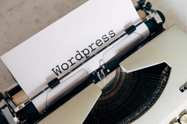 typewriter with the word "wordpress"