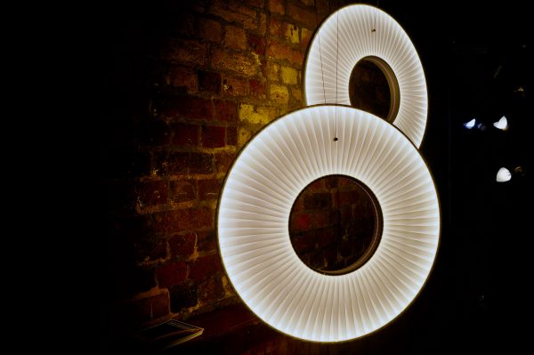 Two light fixtures in the shape of an eight