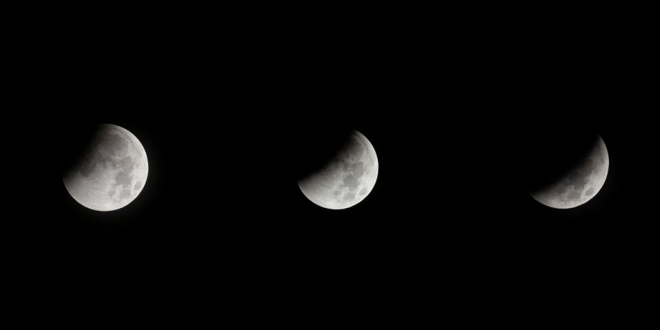 3 moon phases set against black sky