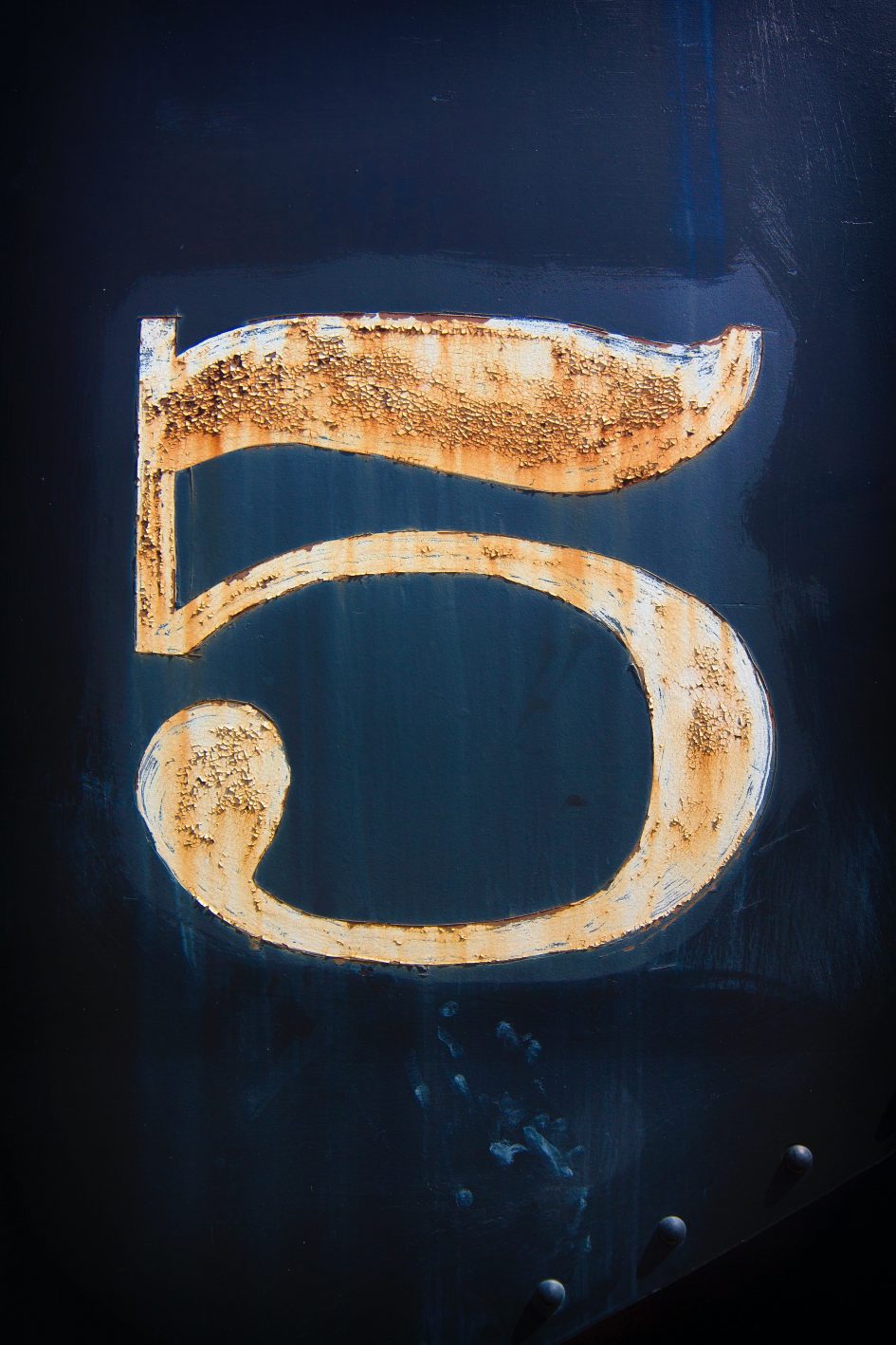 The number 5 on a blue background.