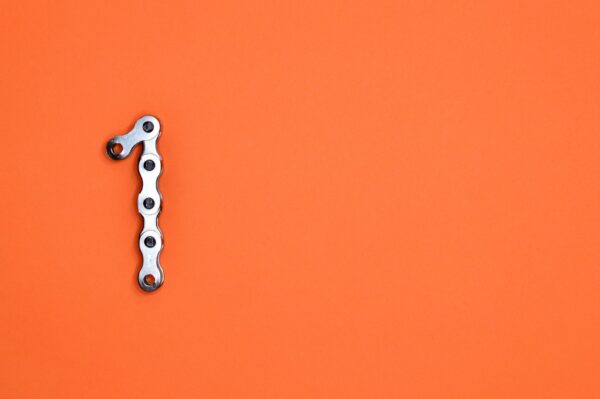 The shape of a one on an orange background.