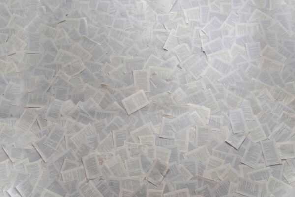 Many papers spread across a table.