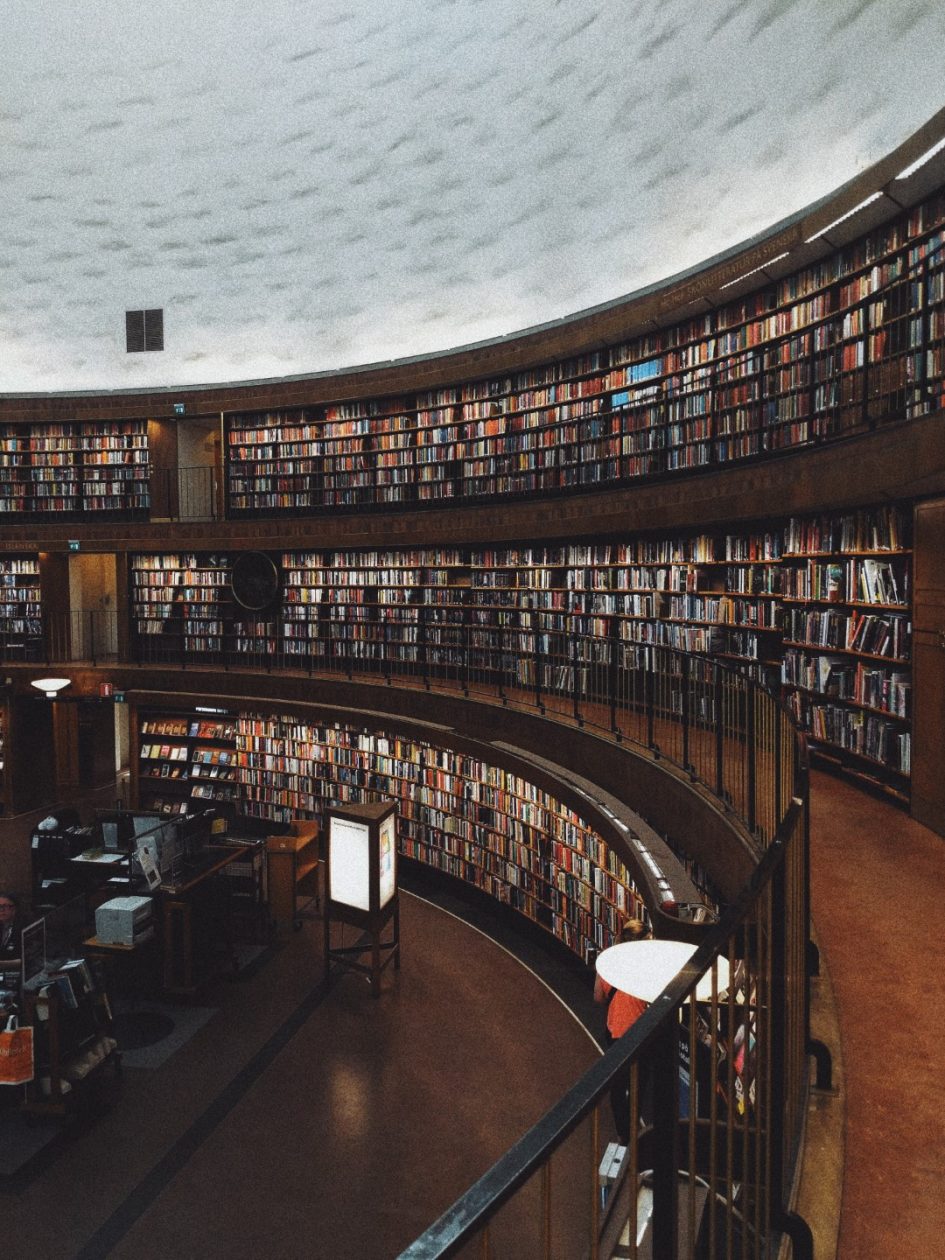 An image of a library with stacks of books displayed